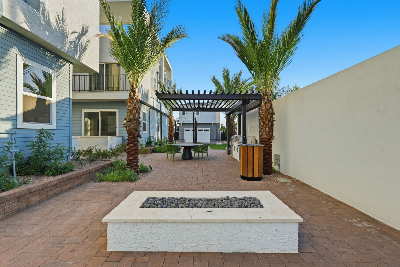 Fire pit and pergola on the paseo